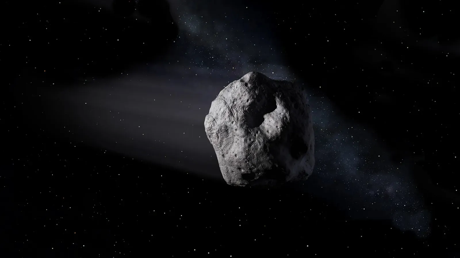 An illustration of an asteroid drifting through space.