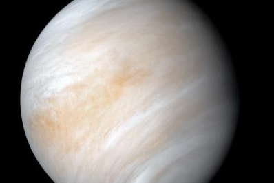 An image of Venus wrapped in dense, global cloud layer.